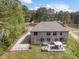 Aerial view of home with brick exterior, large backyard, and patio at 240 Bells Crossing Dr, Mooresville, NC 28117