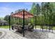 Relaxing backyard patio with comfortable seating and manicured landscaping at 240 Bells Crossing Dr, Mooresville, NC 28117
