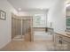 Beautiful bathroom includes tub, shower with glass door and vanity at 240 Bells Crossing Dr, Mooresville, NC 28117