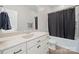 This bathroom features a single sink vanity, a tub, and a decorative mirror at 240 Bells Crossing Dr, Mooresville, NC 28117