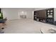 This bonus room features built-in bookcases and an open floorplan at 240 Bells Crossing Dr, Mooresville, NC 28117