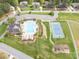 Aerial view of community pool, clubhouse, tennis court, and playground in neighborhood at 240 Bells Crossing Dr, Mooresville, NC 28117