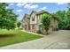Beautiful two-story home with a spacious driveway and well-maintained landscaping at 240 Bells Crossing Dr, Mooresville, NC 28117