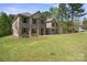 Lovely two-story home with green lawn and professionally landscaped front yard at 240 Bells Crossing Dr, Mooresville, NC 28117