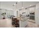 Modern kitchen with granite island, stainless steel appliances, white cabinets, and adjacent dining area at 240 Bells Crossing Dr, Mooresville, NC 28117