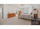 Spacious main bedroom features tray ceilings and light-filled windows at 240 Bells Crossing Dr, Mooresville, NC 28117