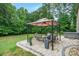 Relaxing backyard patio featuring a gazebo, elegant stone pavers, and a spa at 240 Bells Crossing Dr, Mooresville, NC 28117