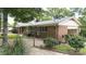 Rear exterior view of a brick home featuring a private yard, patio area, and well-maintained landscaping at 2618 Pineview Dr, Lancaster, SC 29720