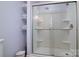 Bathroom featuring glass shower stall and shelving with towels at 2618 Pineview Dr, Lancaster, SC 29720