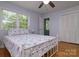 Bedroom with hardwood floors, closet, and large windows providing natural light at 2618 Pineview Dr, Lancaster, SC 29720
