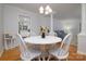 Inviting dining room with a white table and chairs, open layout with views to the living room and kitchen at 2618 Pineview Dr, Lancaster, SC 29720