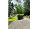 Charming home exterior with an American flag, well-maintained lawn, and gravel driveway at 2618 Pineview Dr, Lancaster, SC 29720