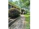Brick home with well-maintained landscaping and a stone pathway leading to the welcoming front entrance at 2618 Pineview Dr, Lancaster, SC 29720