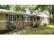Inviting brick home featuring blue shutters and a charming entrance with a white-railed porch at 2618 Pineview Dr, Lancaster, SC 29720