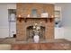 Living room brick fireplace featuring raised hearth, mantel, and built-in cabinetry at 2618 Pineview Dr, Lancaster, SC 29720
