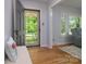 Foyer featuring a glass door letting in light, hardwood floors, bench, and an open view to the living room at 2618 Pineview Dr, Lancaster, SC 29720