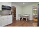 Eat-in kitchen area with charming built-in bench seating and view into the living room at 2618 Pineview Dr, Lancaster, SC 29720