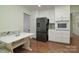 Eat-in kitchen features white cabinetry, stainless steel appliances and a built-in booth at 2618 Pineview Dr, Lancaster, SC 29720