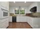 Bright kitchen featuring stainless steel appliances, granite countertops, and tile backsplash at 2618 Pineview Dr, Lancaster, SC 29720
