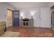View of living room featuring front entry door and console table with lamps at 2618 Pineview Dr, Lancaster, SC 29720