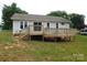 Spacious backyard with a large wooden deck, perfect for outdoor entertaining and relaxation at 3001 Austin Chaney Rd, Monroe, NC 28110