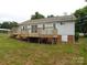Expansive wooden deck in the backyard with access to the home and a view of the yard at 3001 Austin Chaney Rd, Monroe, NC 28110