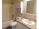Bathroom featuring a sink, toilet, shower/tub combo, and an upper cabinet at 3001 Austin Chaney Rd, Monroe, NC 28110