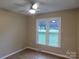 Bedroom with a ceiling fan and two windows providing natural light at 3001 Austin Chaney Rd, Monroe, NC 28110
