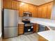 Modern kitchen with stainless steel appliances, white subway tile backsplash, and wooden cabinets at 3001 Austin Chaney Rd, Monroe, NC 28110