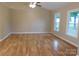 Bright living room with natural light, hardwood floors, and neutral wall paint at 3001 Austin Chaney Rd, Monroe, NC 28110