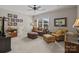 Comfortable living room with plush seating, a ceiling fan, and natural light from the window at 3009 Botetourt Ct, Matthews, NC 28104