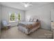 Bedroom with white walls, carpet, and natural lighting at 3009 Botetourt Ct, Weddington, NC 28104