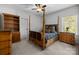 Comfortable bedroom with four poster bed, soft carpet, and natural light at 3009 Botetourt Ct, Weddington, NC 28104