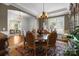 Elegant dining room featuring a chandelier, large window, and formal seating for sophisticated meals at 3009 Botetourt Ct, Weddington, NC 28104