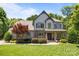 Charming two-story home with stone accents, manicured lawn, and a beautiful red maple tree at 3009 Botetourt Ct, Weddington, NC 28104