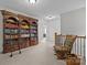 Hallway with a library featuring a rolling ladder at 3009 Botetourt Ct, Weddington, NC 28104