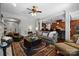 Inviting living room featuring a decorative rug, stylish furnishings, and an open layout connecting to the kitchen at 3009 Botetourt Ct, Weddington, NC 28104