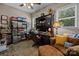 Functional home office with natural light, built-in desk, and comfortable seating, perfect for remote work at 3009 Botetourt Ct, Weddington, NC 28104