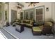Inviting covered patio with comfortable seating, ceiling fans, and stylish decor for outdoor relaxation at 3009 Botetourt Ct, Weddington, NC 28104
