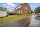Brick townhome with well-maintained lawn and landscaping at 3013 Coventry Commons Dr, Mint Hill, NC 28227