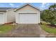 A detached one car garage with a white garage door and concrete driveway at 3013 Coventry Commons Dr, Mint Hill, NC 28227