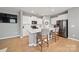 Modern kitchen with white cabinets, stainless steel appliances, and quartz countertops at 3013 Coventry Commons Dr, Mint Hill, NC 28227