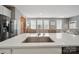 Spacious kitchen island featuring a stainless steel sink and modern faucet at 3013 Coventry Commons Dr, Mint Hill, NC 28227