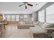 Comfortable living room with a large sectional sofa, ceiling fan and natural light at 3013 Coventry Commons Dr, Mint Hill, NC 28227
