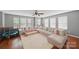 Bright living area featuring a large sectional sofa, plush carpet, and natural light from the large windows at 3013 Coventry Commons Dr, Mint Hill, NC 28227