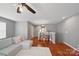 Well-lit living room area with hardwood floors and cozy sectional sofa at 3013 Coventry Commons Dr, Mint Hill, NC 28227