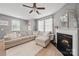 Relaxing living room features a fireplace and comfortable sectional sofa at 3013 Coventry Commons Dr, Mint Hill, NC 28227