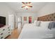 Bright main bedroom with hardwood floors, a plush bed, and a white dresser at 3013 Coventry Commons Dr, Mint Hill, NC 28227