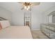 A main bedroom with neutral walls, carpet flooring, ceiling fan, and a view of another room at 3013 Coventry Commons Dr, Mint Hill, NC 28227