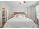Spacious main bedroom featuring a plush bed and ample natural light at 3013 Coventry Commons Dr, Mint Hill, NC 28227